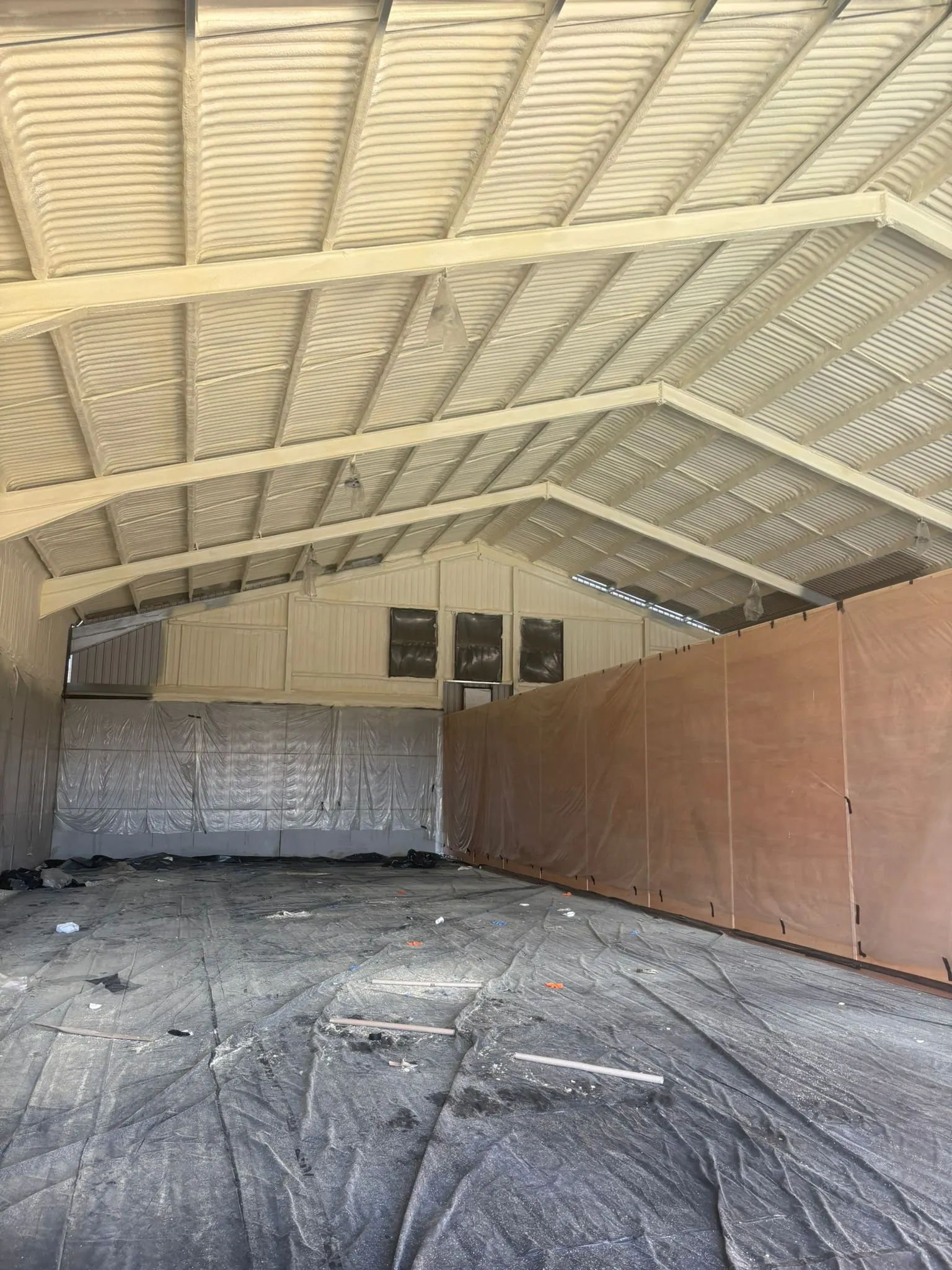 Spray foam insulation applied to hangars — real Duratite Group project