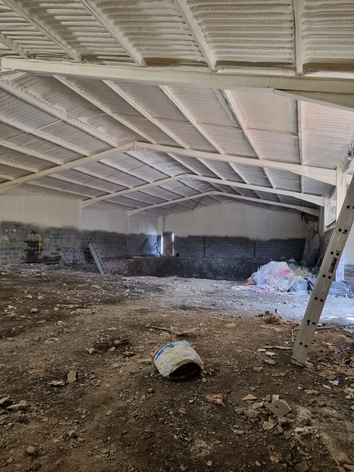 Spray foam insulation applied to hangars — real Duratite Group project
