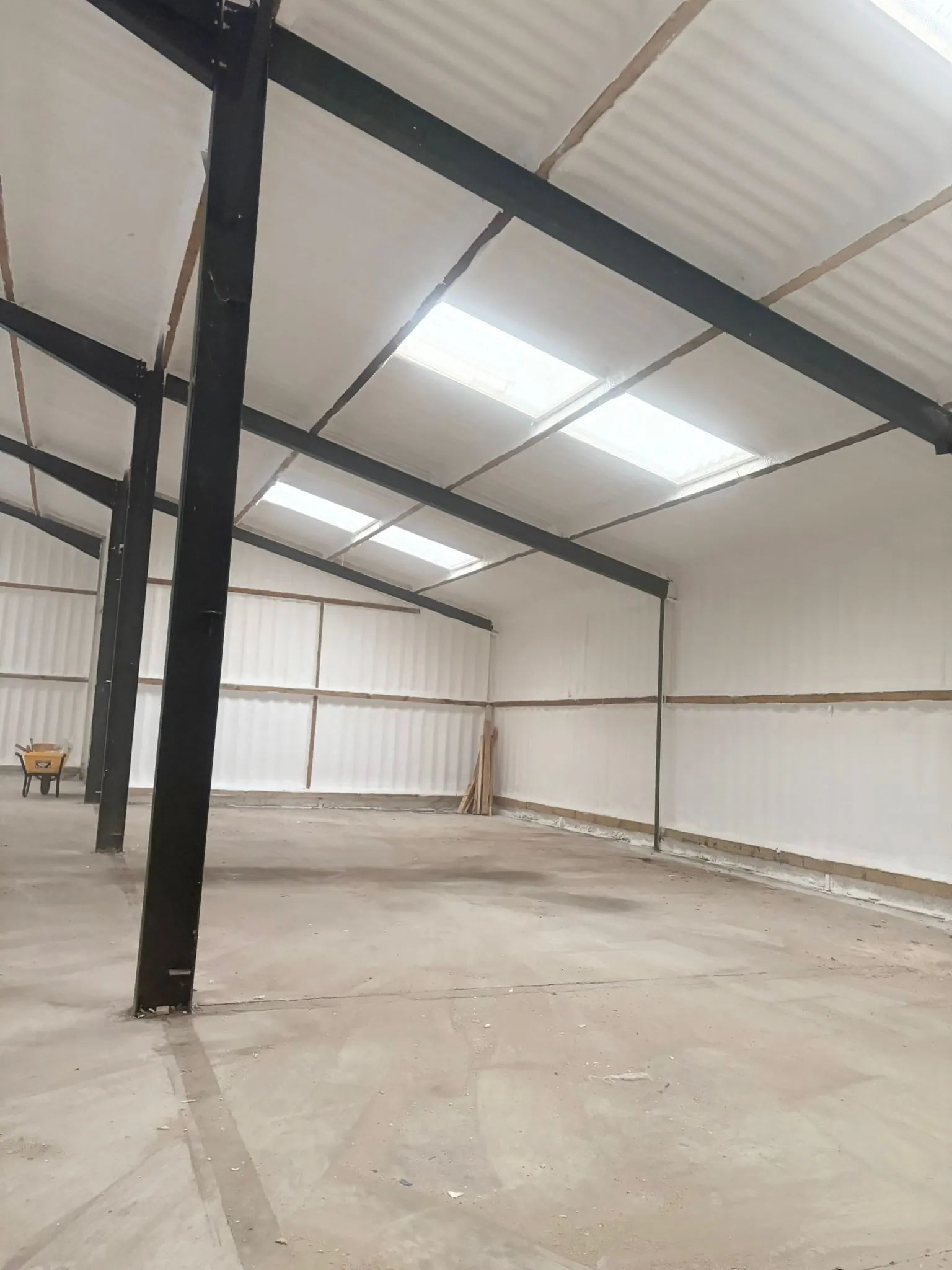 Spray foam insulation applied to hangars — real Duratite Group project
