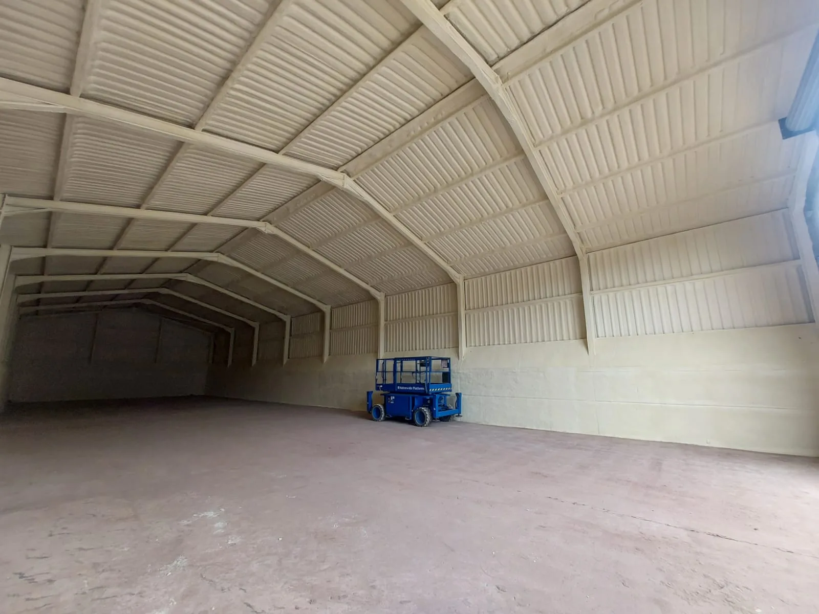 Insulation within a dairy-parlour building.