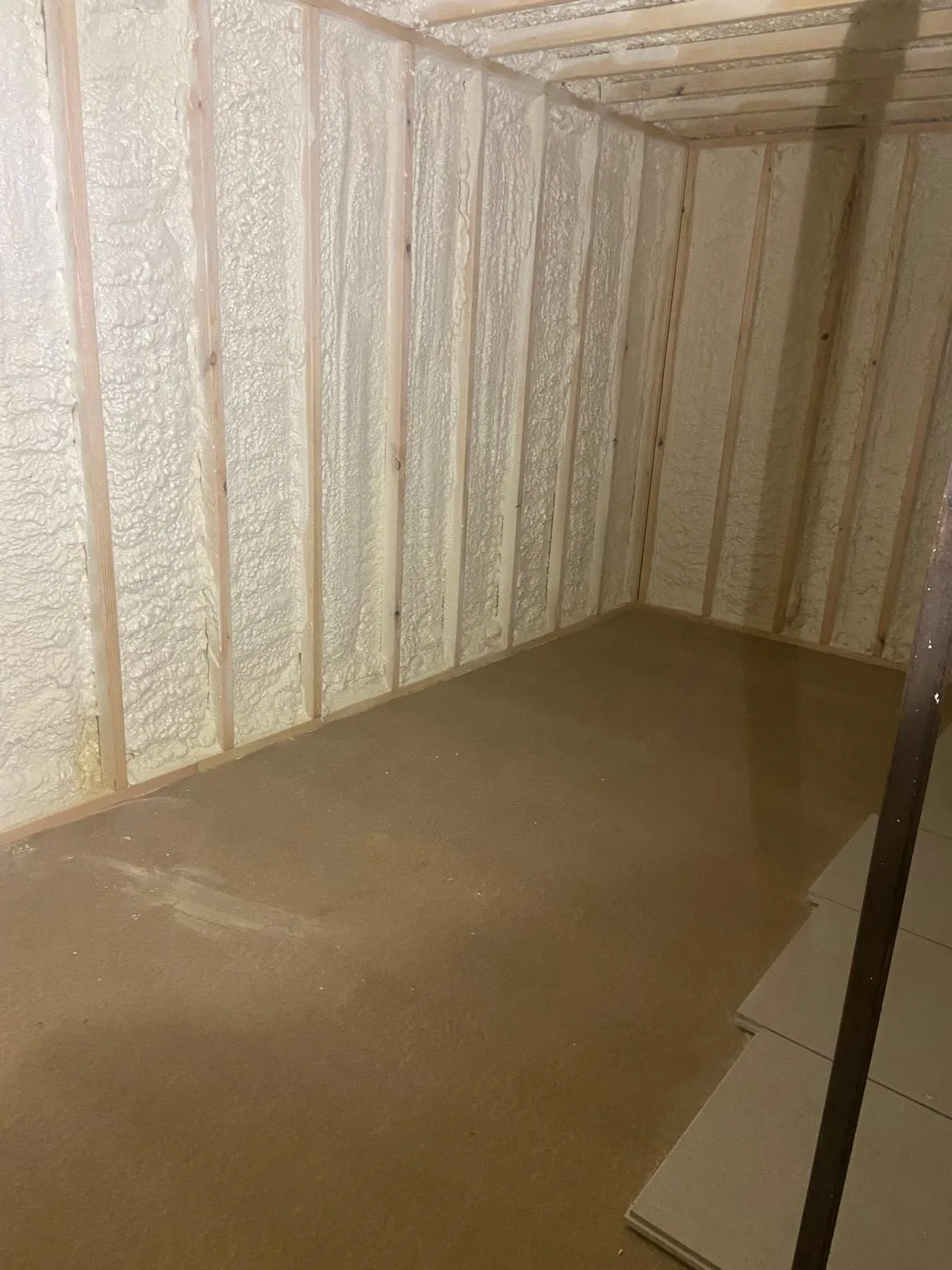 Insulation between timber studs in a container conversion.
