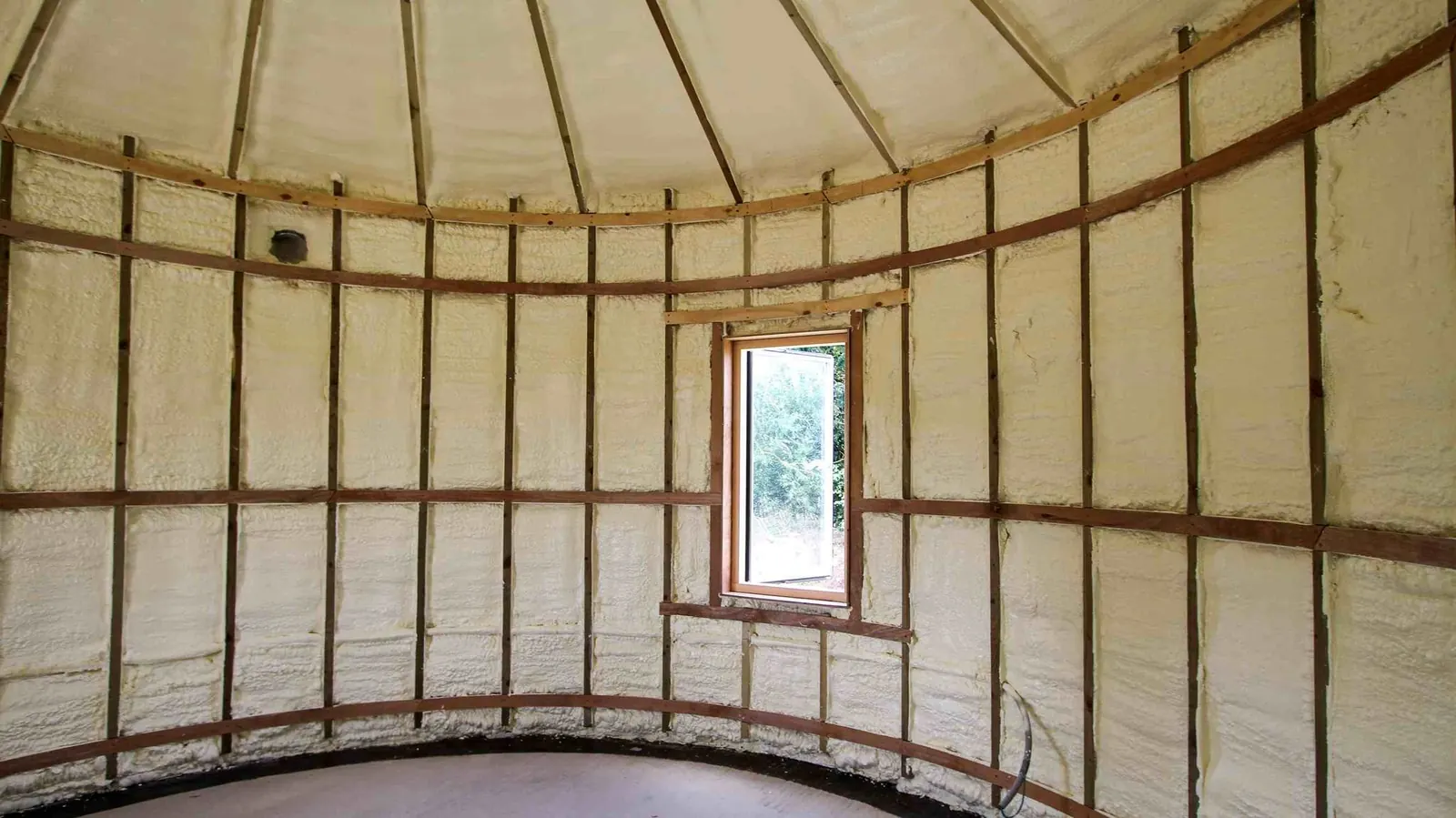 Spray foam insulation applied to Nissen huts — real Duratite Group project