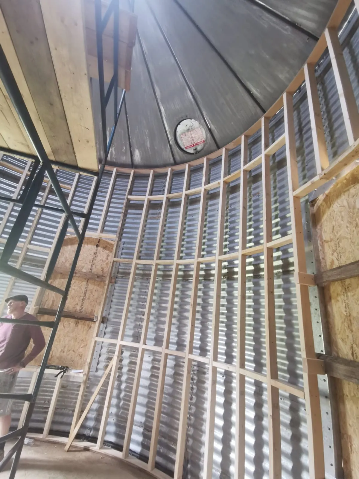 Spray foam insulation applied to Quonset huts — real Duratite Group project