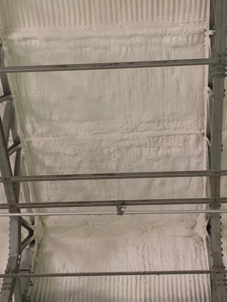 Spray foam insulation applied to asbestos roofs — real Duratite Group project