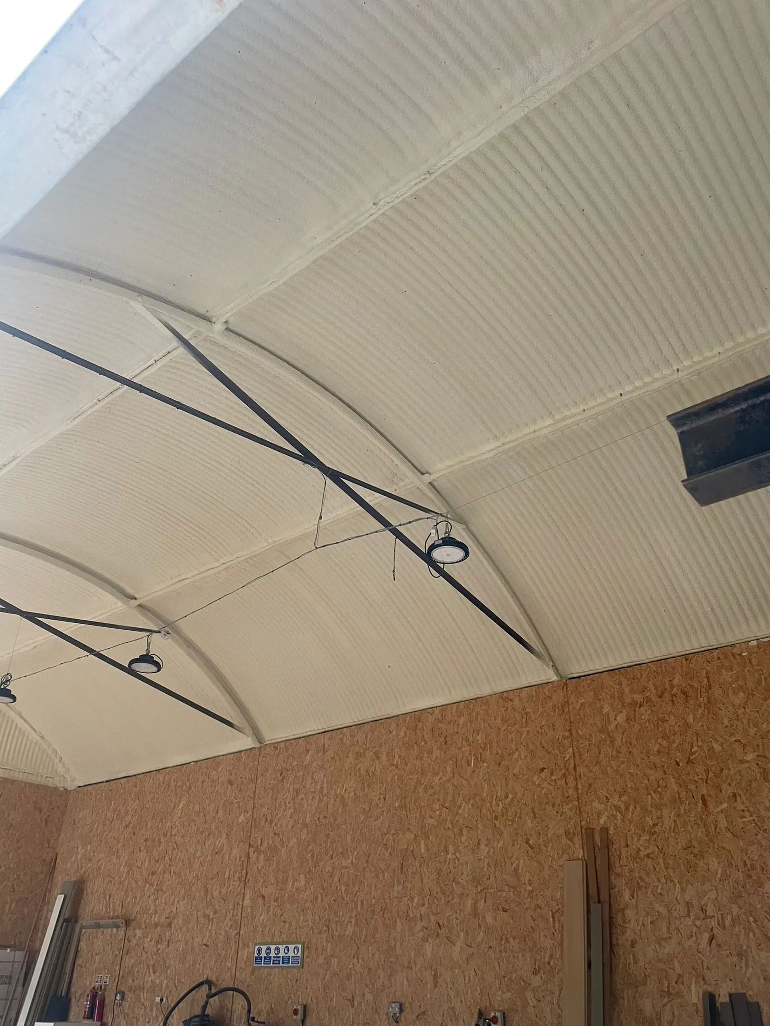 Spray foam insulation applied to Nissen huts — real Duratite Group project