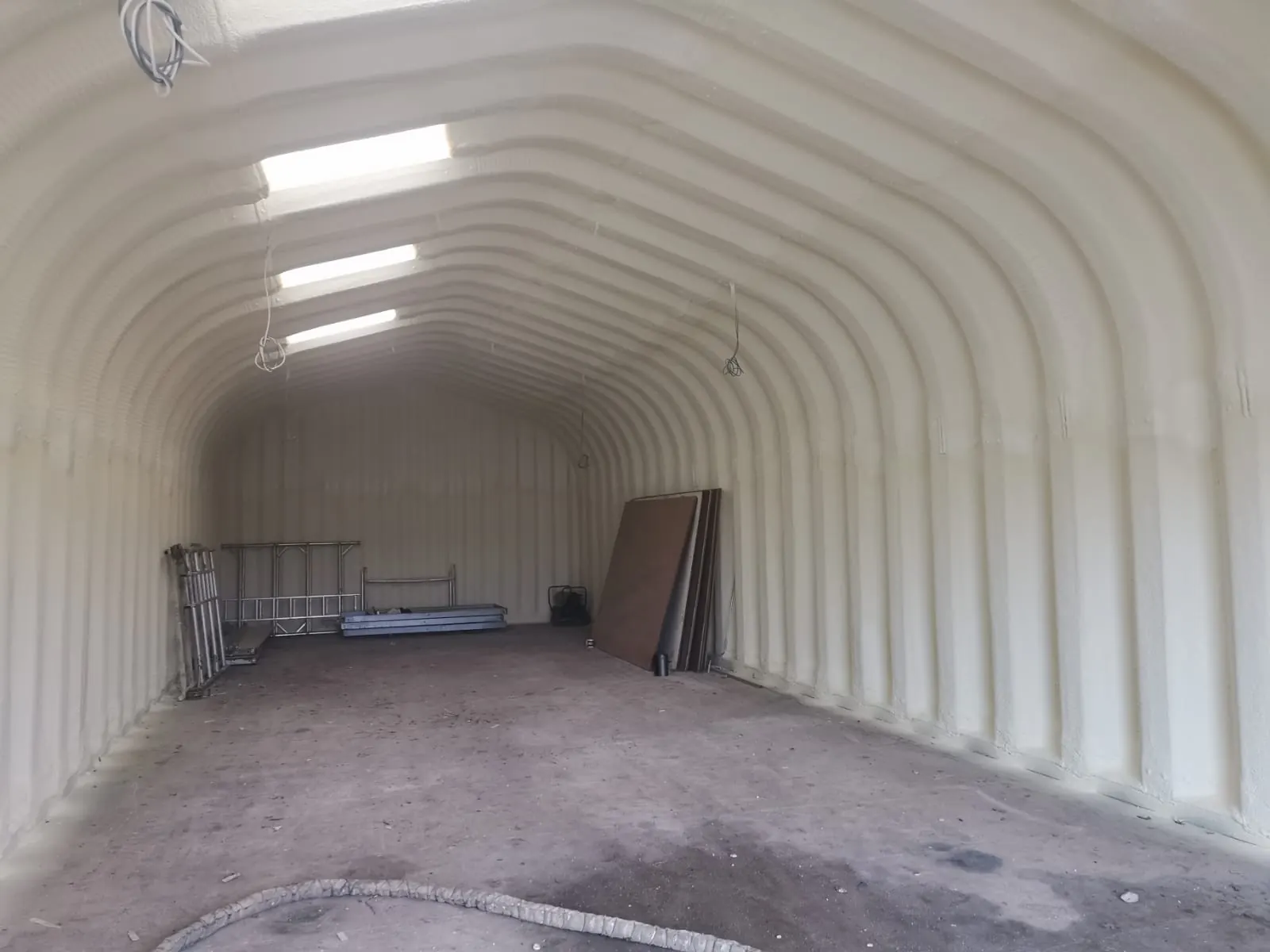 Spray foam insulation applied to Nissen huts — real Duratite Group project