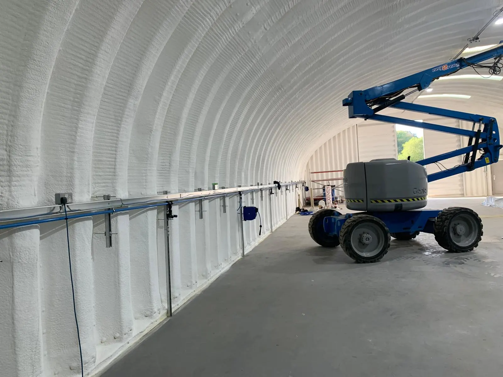 Spray foam insulation applied to Nissen huts — real Duratite Group project