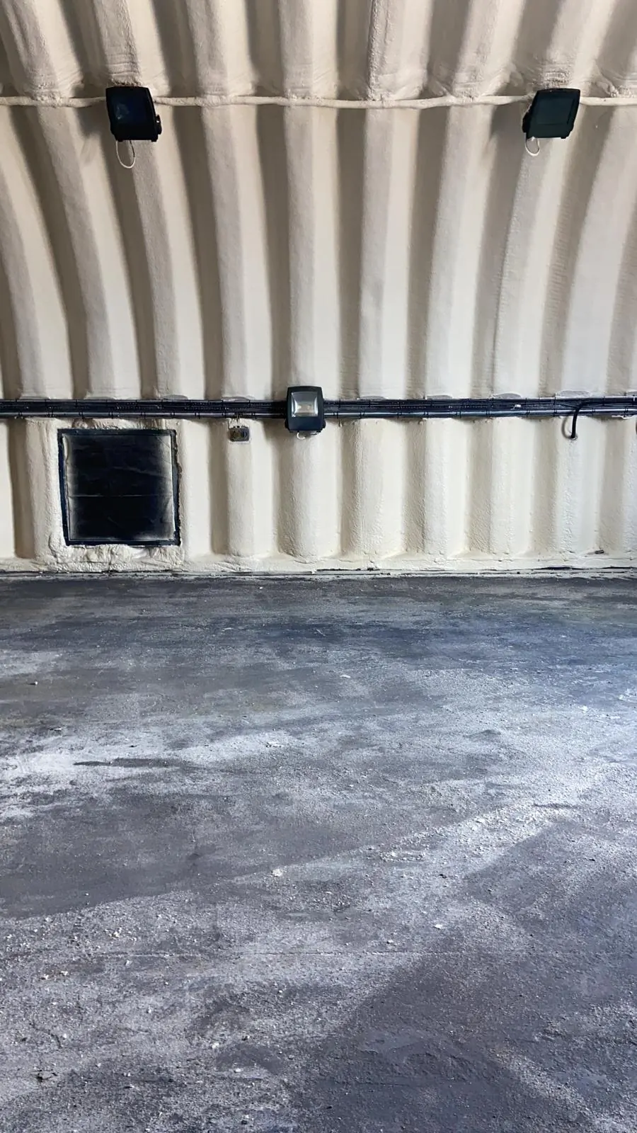Spray foam insulation applied to Nissen huts — real Duratite Group project