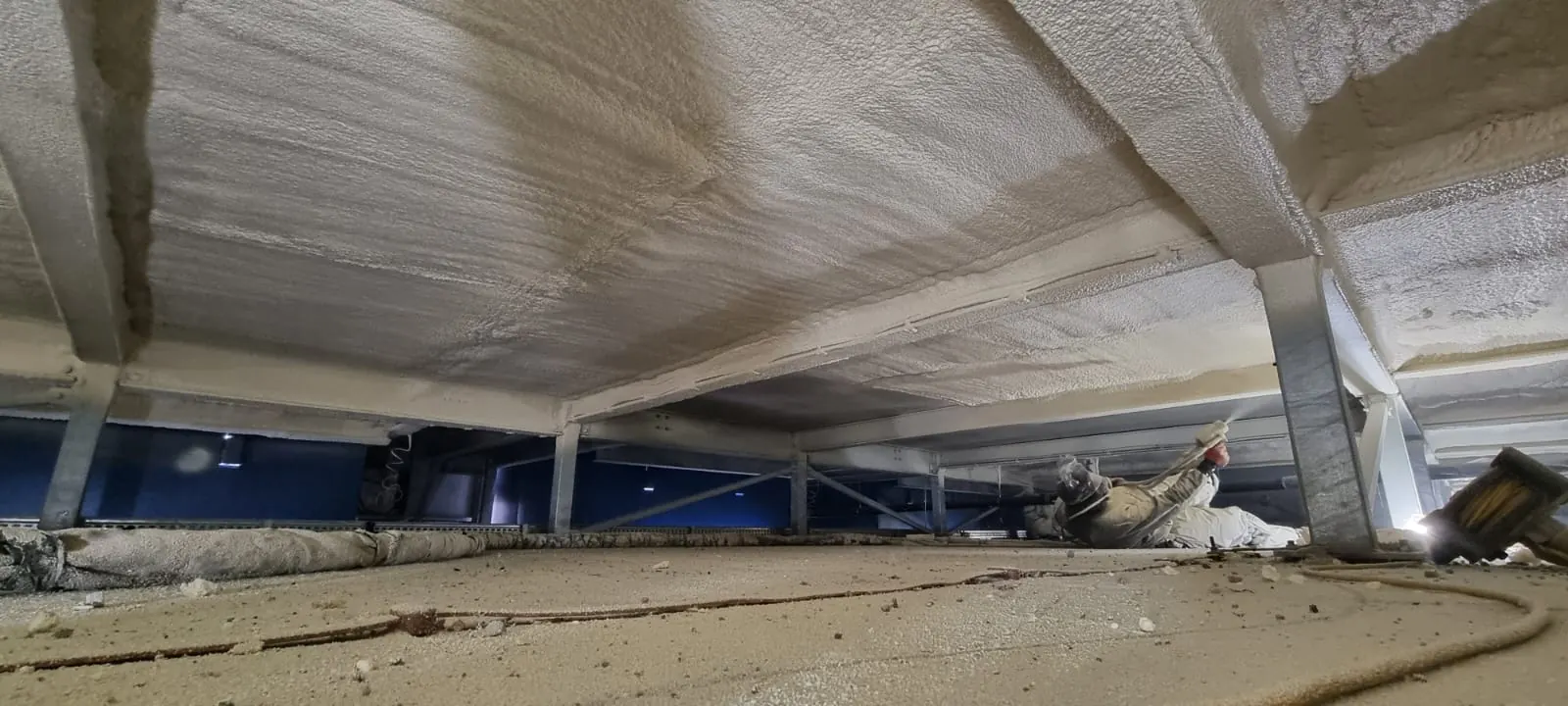 Spray foam insulation applied to ceiling voids — real Duratite Group project