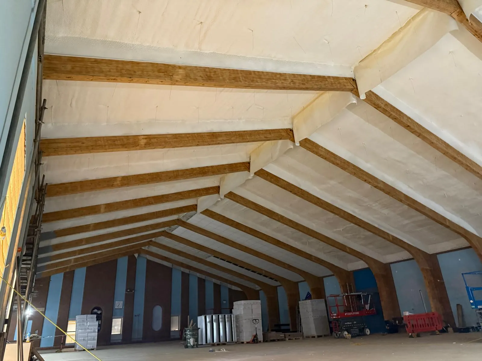 Spray foam insulation applied to pool halls — real Duratite Group project
