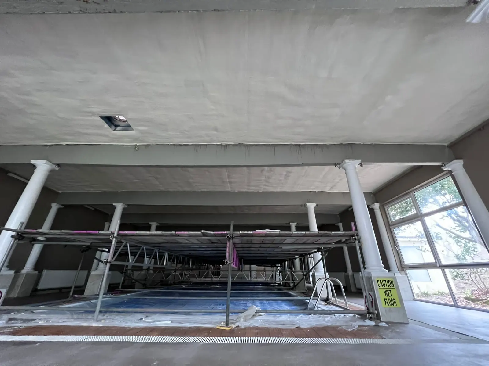 Spray foam insulation applied to pool halls — real Duratite Group project
