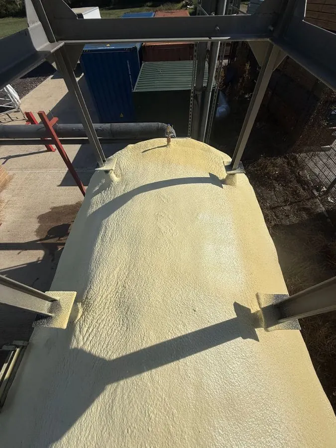Sprayed insulation with a protective topcoat for long-term exposure