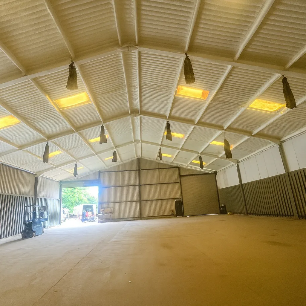 Completed: insulation across the roof bays, with rooflights left clear.